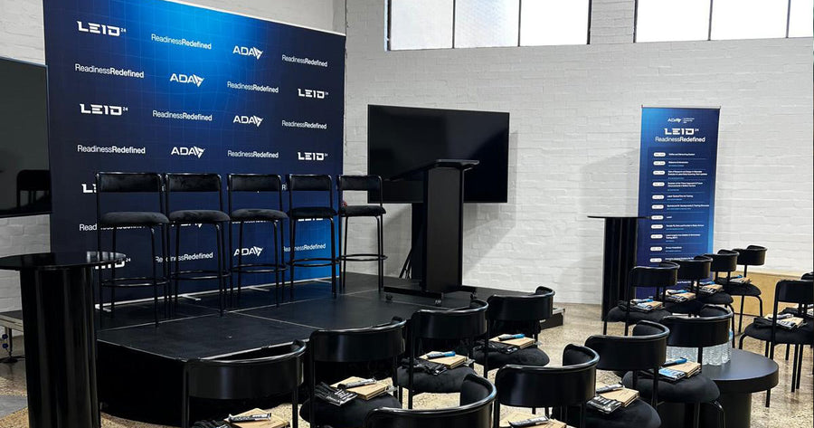 ADA and LEGEAR LEID event display with custom media wall and pull-up banner signage