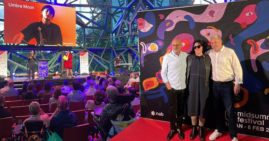 Djirri Djirri Dancers performing on stage with pull-up banners beside them.