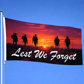 Lest We Forget ANZAC flag with five soldier silhouettes at sunset