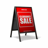 Red clearance sale sign on a white background