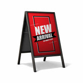 Red and black a-frame sign with 'New Arrival' text on a white background