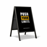 A-frame sign with 'Push Your Limits' text on a white background