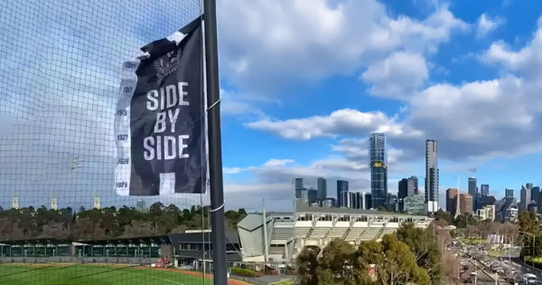 AFL Finals flags by Evan Evans – custom printed outdoor signage at Melbourne’s stadium precinct.