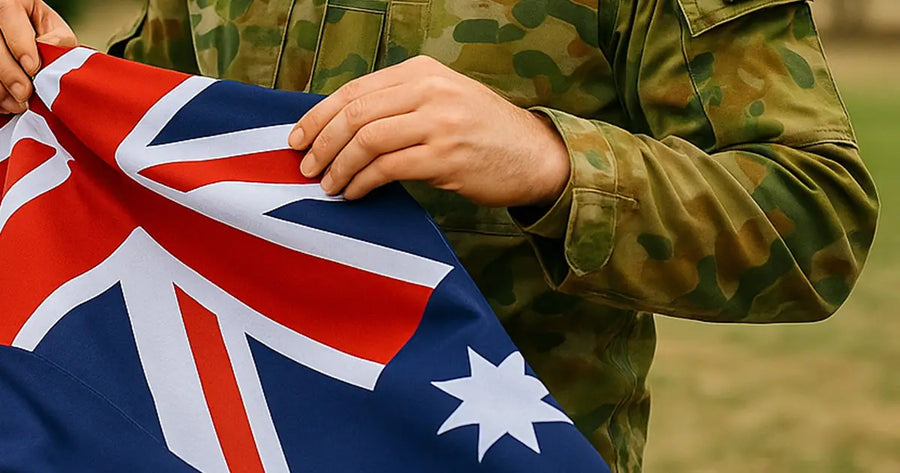 Australian soldier folding the Australian National Flag outdoors in uniform