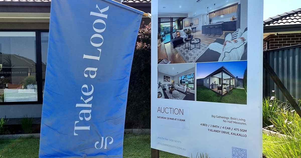 Real estate signboard flag for Jenson Property installed at property listing | Custom signage by Evan Evans Australia