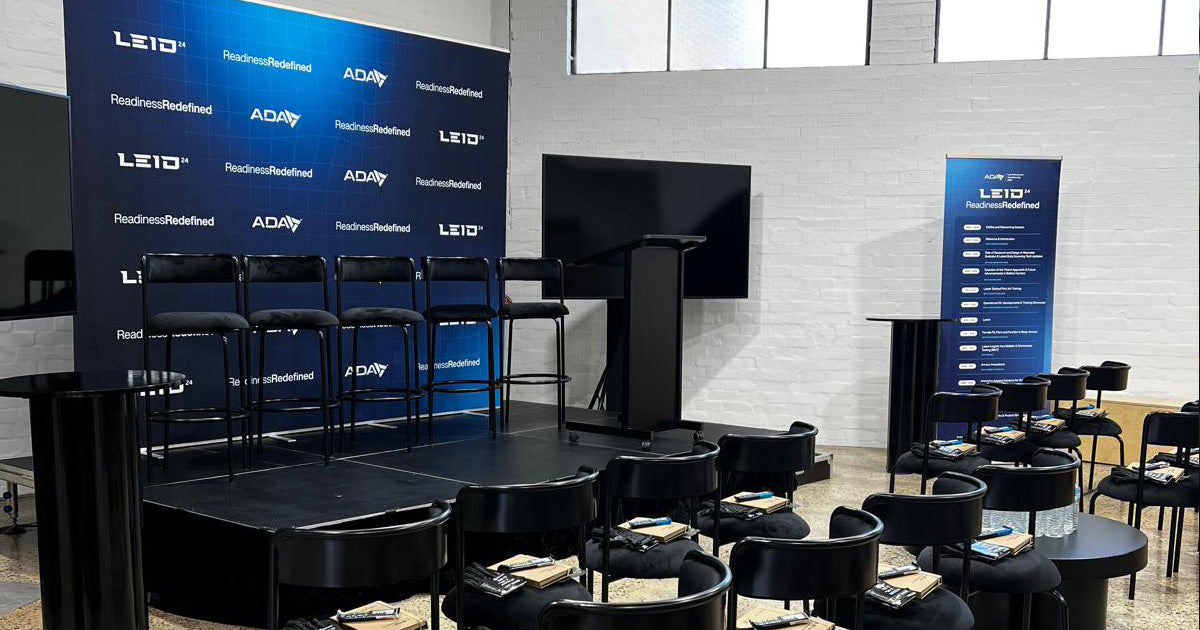 ADA and LEGEAR LEID event display with custom media wall and pull-up banner signage | Custom signage by Evan Evans Australia