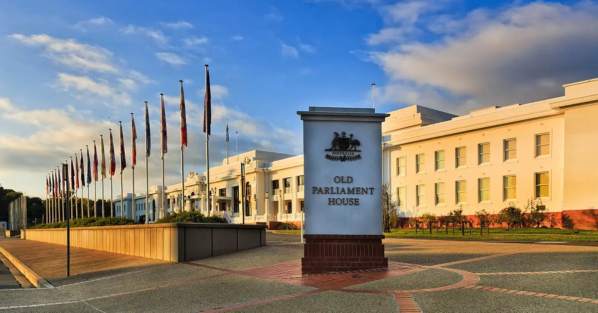 Government and council signage with flags outside a civic building