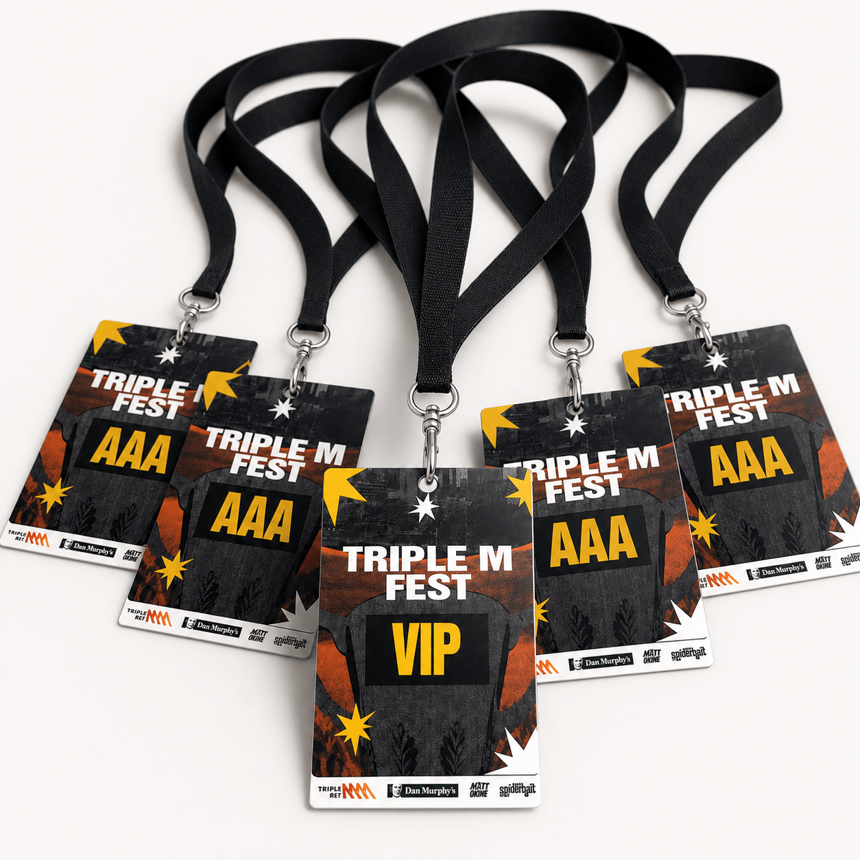 Five black lanyard event badges with 'TRIPLE M FEST AAA' and 'VIP' text, arranged in a fan shape on a white background.