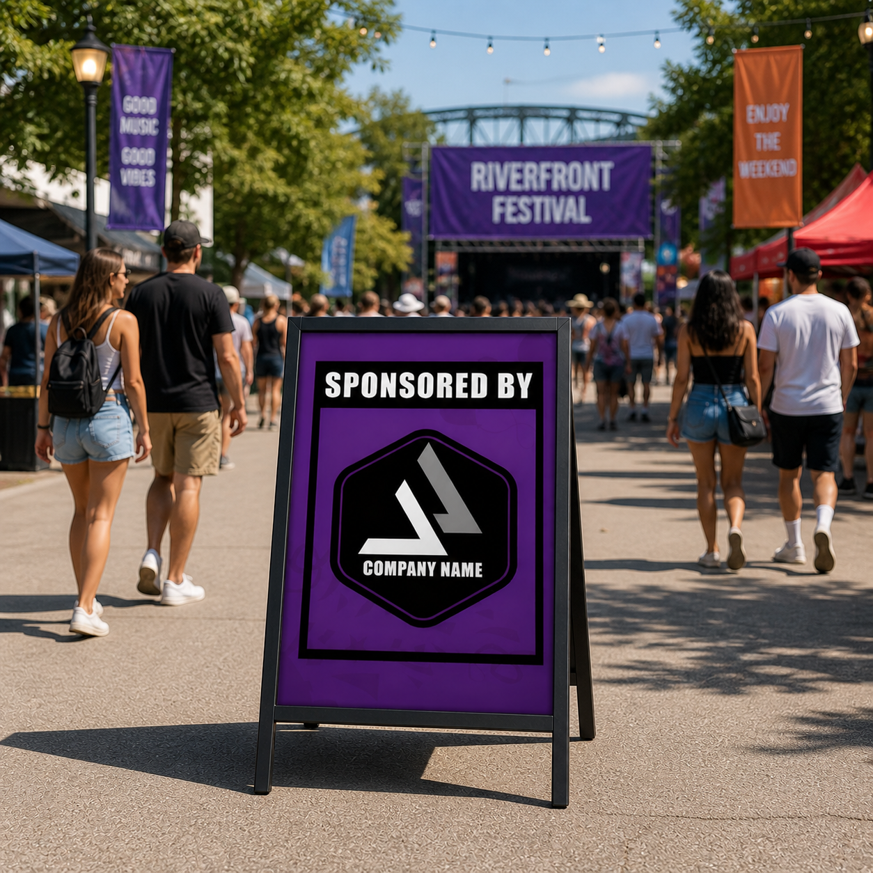 Purple sponsor sign at a Riverfront Festival with people walking around.