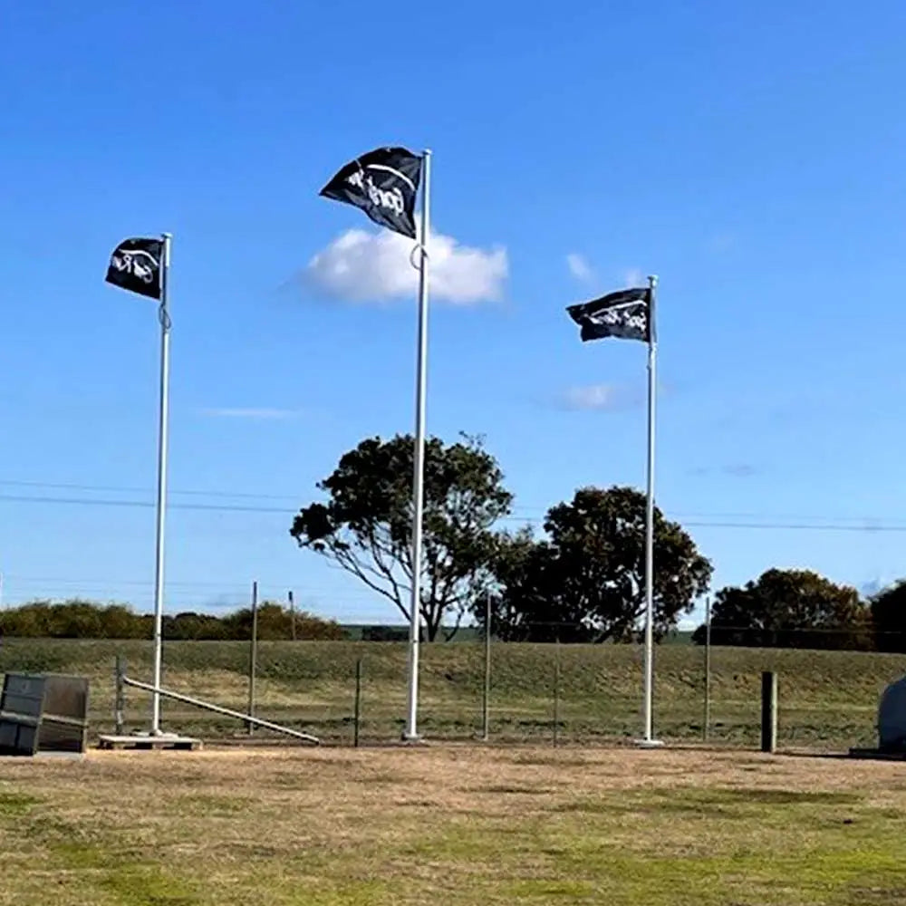 Three Gorst Rural Custom Flag on a field