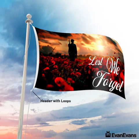 Lest We Forget flag with a soldier standing in a poppy field at sunset, symbolizing remembrance for ANZAC Day and Remembrance Day.