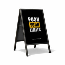 A-frame sign with 'Push Your Limits' text on a white background
