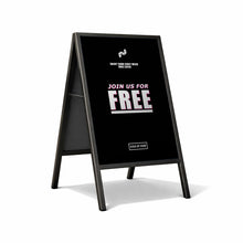 Black a-frame sign with white text inviting people to join for free on a white background
