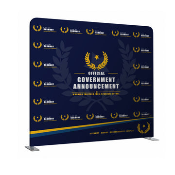 Navy blue backdrop with gold laurel wreath and text for official government announcement