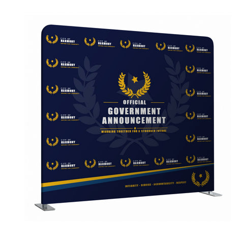 Navy blue backdrop with gold laurel wreath and text for official government announcement