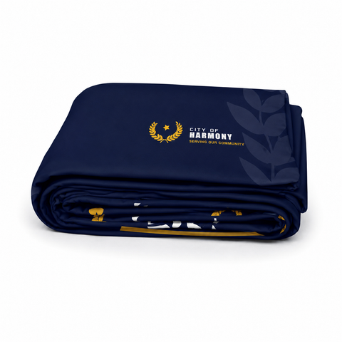 Folded navy media wall skin with 'City of Harmony' logo on a white background